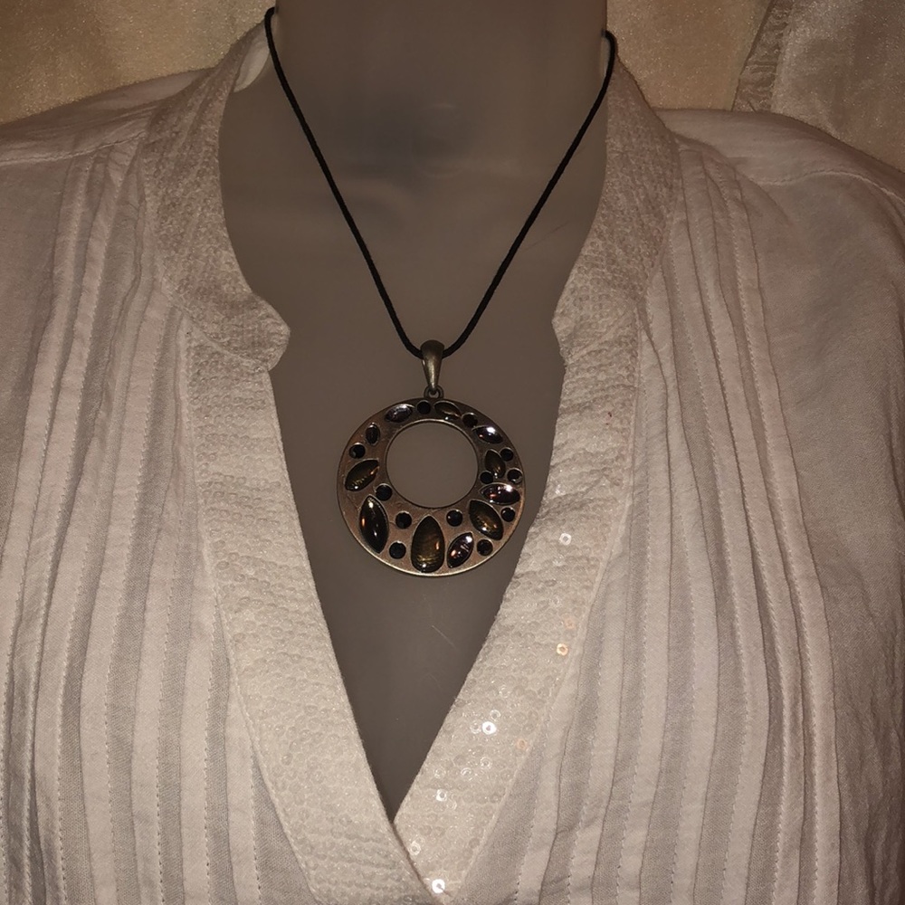 Opal white V-neck blouse with different necklaces
